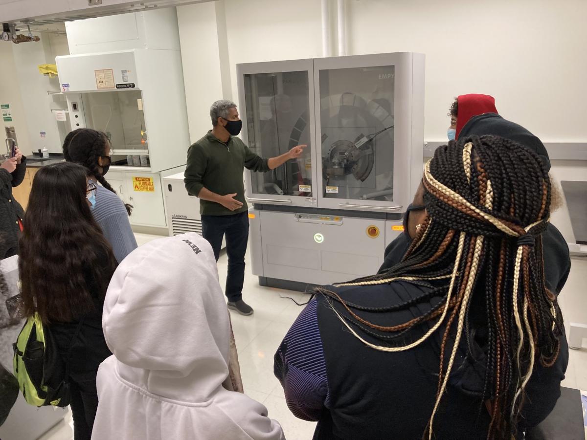 A group of high school students taking a tour of an NNF lab.